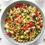10-Minute Mediterranean Chickpea Salad with chickpeas, cucumber, tomatoes, olives, feta, and homemade vinaigrette