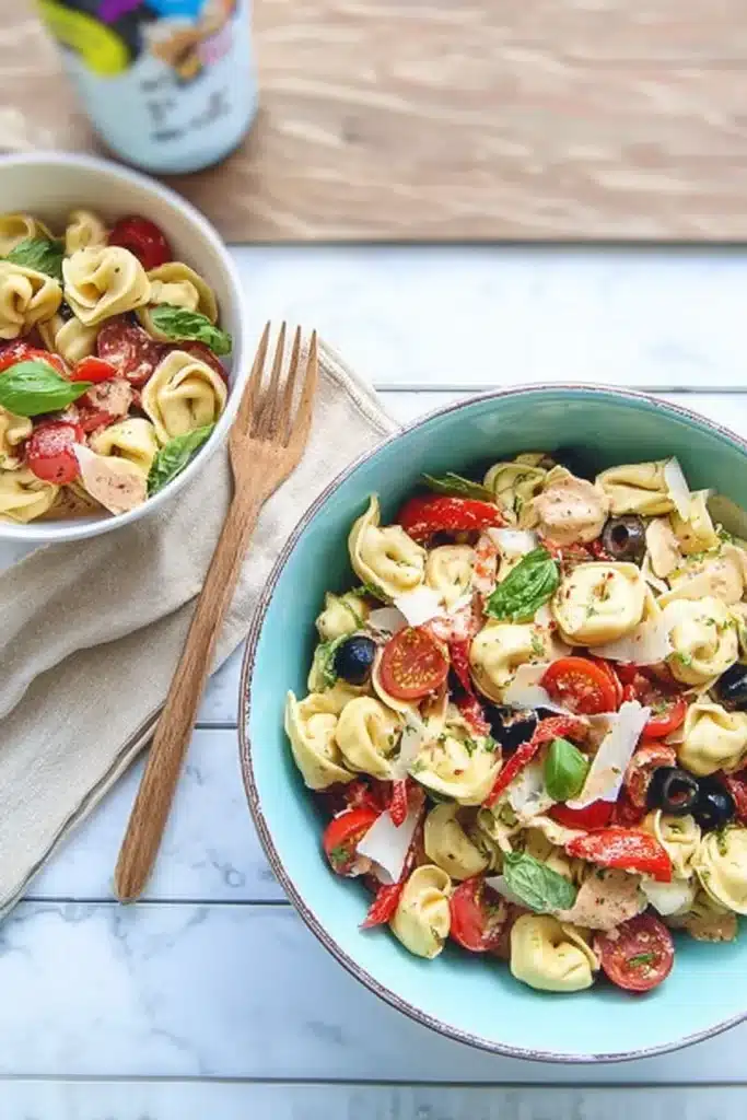 Parmesan Tortellini Salad | Amazing Easy Summer Favorite 6 Parmesan Tortellini Salad served in bowls with basil, roasted peppers, and olives