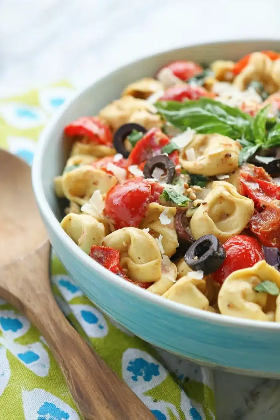 home 7 Parmesan Tortellini Salad with roasted red peppers, basil, tomatoes, and olives
