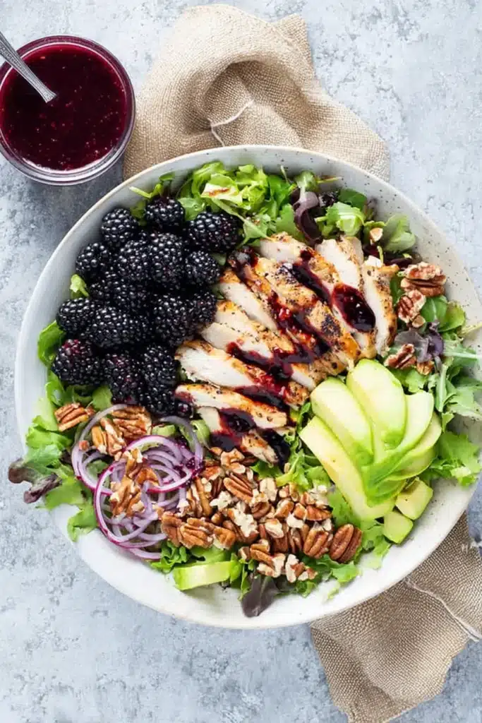 Blackberry chicken salad with avocado, walnuts, fresh greens, and homemade blackberry dressing
