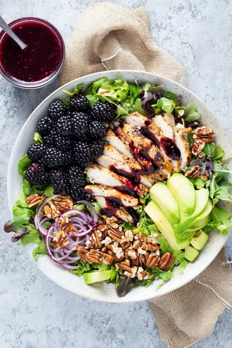 Blackberry chicken salad with avocado, walnuts, fresh greens, and homemade blackberry dressing