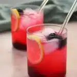 Blackberry lemonade with lemon slices, blackberries, and ice