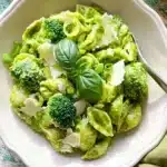 Broccoli Pasta Recipe | Amazing Easy Weeknight Dinner 9 Creamy broccoli pasta with parmesan, basil, and tender broccoli florets in a white bowl