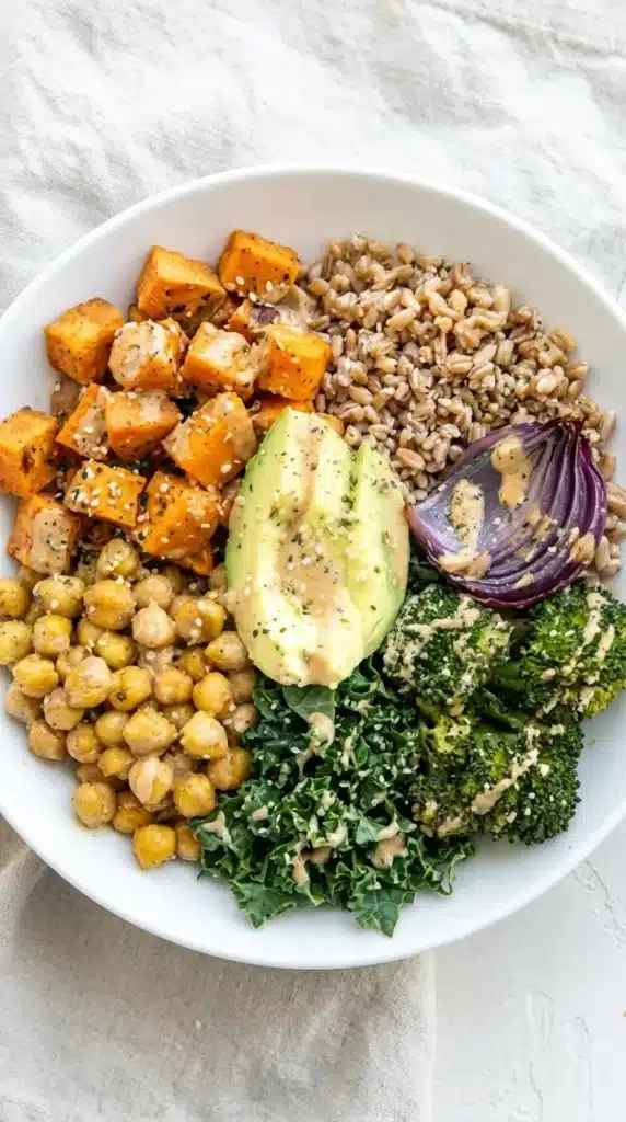 Broccoli Sweet Potato Bowl with avocado, roasted chickpeas, broccoli, and tahini dressing