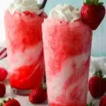 Coffee Creamer + Soda strawberry mocktail with creamy pink swirls and whipped cream
