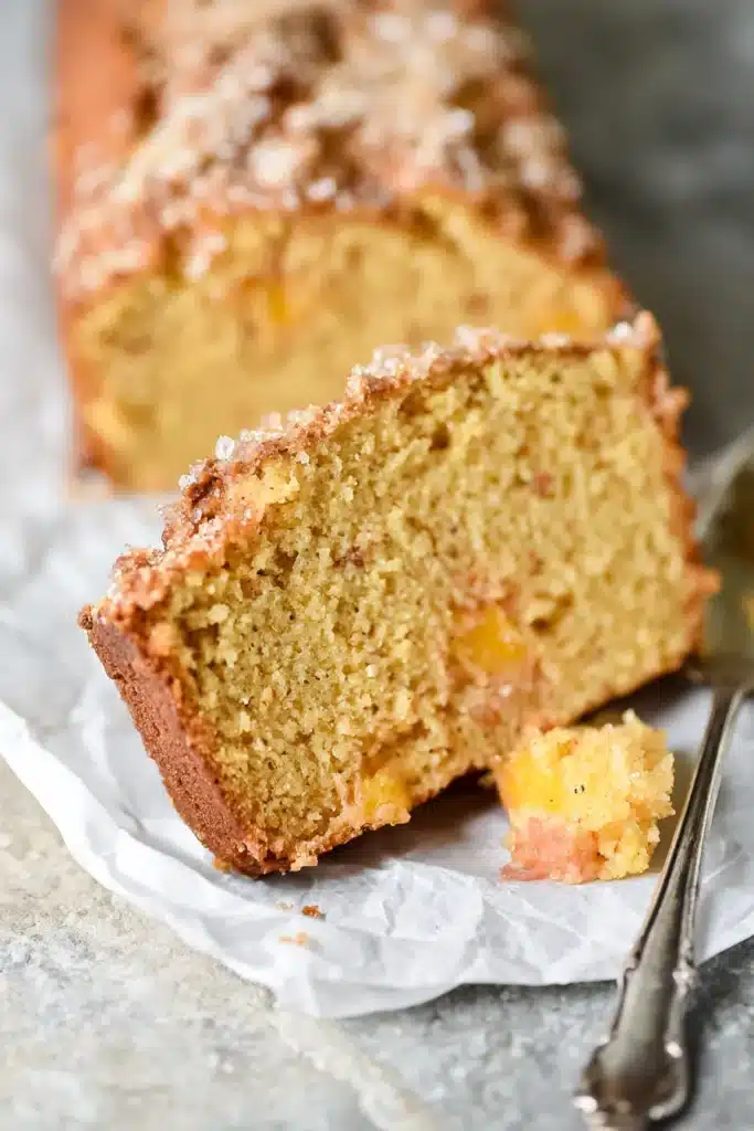 Easy Spiced Peach Bread Recipe | Amazing Cozy Flavor 8 Easy Spiced Peach Bread slices with crunchy sugar topping and golden crust