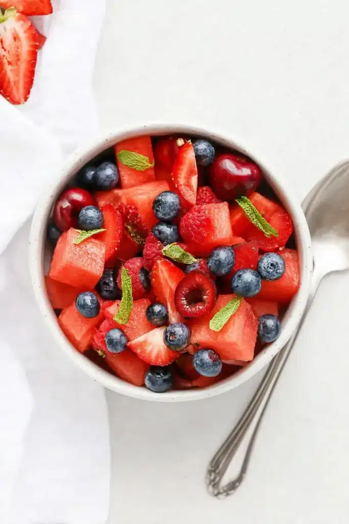 Fresh Watermelon Fruit Salad | Amazing Easy Summer Favorite 8 Fresh Watermelon Fruit Salad served in a bowl with berries, cherries, and mint