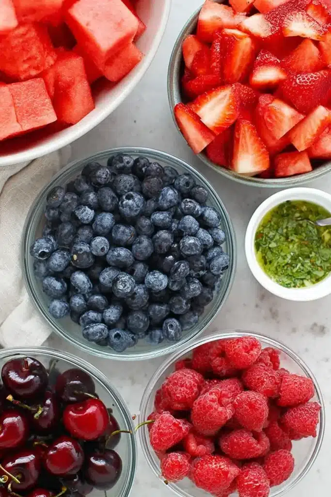 Fresh Watermelon Fruit Salad | Amazing Easy Summer Favorite 6 Fresh Watermelon Fruit Salad ingredients with berries, cherries, watermelon, and mint dressing