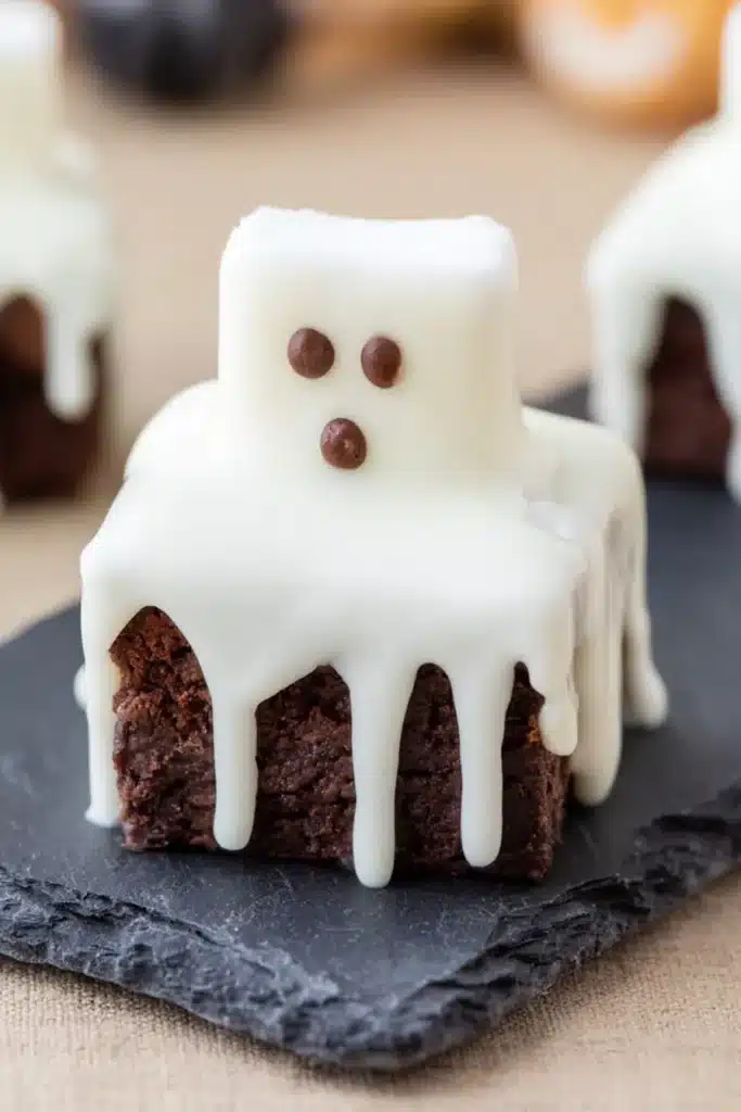 Ghost brownies with marshmallow ghosts on fudgy chocolate brownies for Halloween