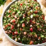 Lentil tabbouleh salad with parsley, tomatoes, lentils, and lemon