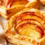 Mini peach and cream cheese tarts with flaky pastry and fresh peaches