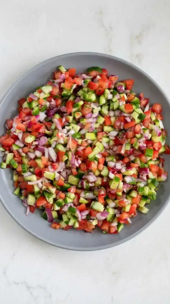 Persian Shirazi Salad with cucumbers, tomatoes, red onion, and citrus dressing