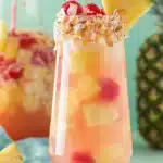 Pina Colada Sangria Recipe: Amazing Tropical Summer Favorite 7 Pina Colada Sangria with pineapple, cherries, and toasted coconut rim