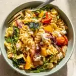 Roasted Veggie Pasta Recipe | Amazing Easy Family Dinner 7 Roasted veggie pasta with feta cheese, zucchini, tomatoes, and arugula in a bowl