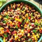 The BEST Cowboy Caviar Ever | Amazing Easy Party Favorite 7 The BEST Cowboy Caviar Ever served with tortilla chips and fresh lime