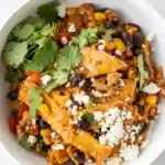 Turkey Enchilada Skillet with black beans, corn, cheese, and cilantro in a bowl