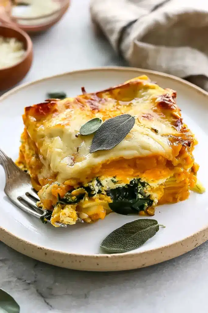 Vegetarian Pumpkin Spinach Lasagna Amazing Fall Favorite 6 Vegetarian Pumpkin Spinach Lasagna slice with sage and cheese