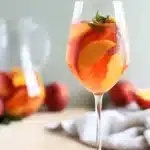 White Peach Sangria Recipe | Amazing Summer Favorite 7 White Peach Sangria with fresh peach slices in a chilled summer wine cocktail