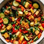 Zucchini stir fry with tofu, carrots, and bell peppers