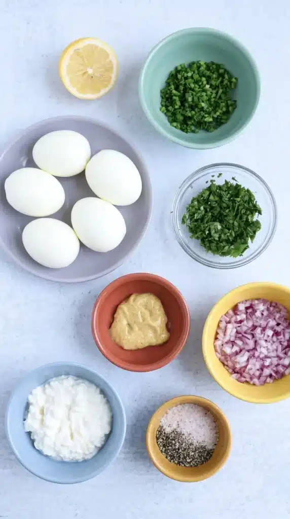 Cottage Cheese Egg Salad Recipe | Amazing Easy Lunch 6 Cottage Cheese Egg Salad ingredients with eggs, cottage cheese, herbs, onion, mustard, and lemon.