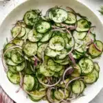 Easy Cucumber Salad | Amazing Fresh Summer Recipe 9 Easy Cucumber Salad with fresh dill, red onion, and light vinaigrette served in a ceramic bowl.