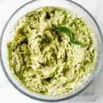 Easy Pesto Chicken Salad Recipe | Amazing Easy Dinner 7 Easy Pesto Chicken Salad with shredded chicken, creamy basil pesto, and Greek yogurt in a ceramic bowl.