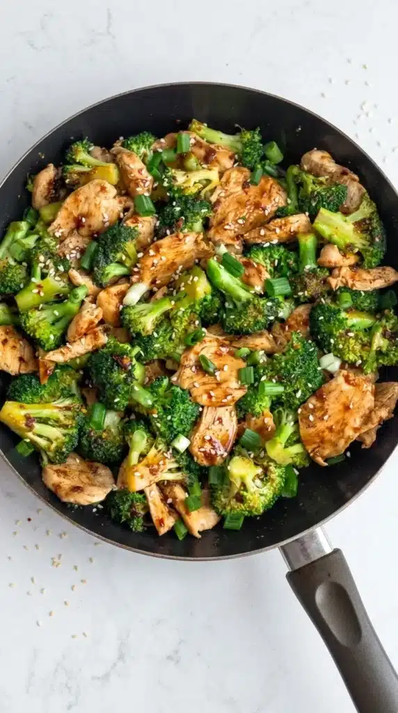 Healthy Chicken and Broccoli stir fry with sesame seeds and green onions