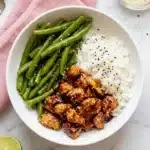Healthy Sesame Chicken Recipe | Amazing Easy 35 Minute Dinner 7 Healthy Sesame Chicken with white rice and green beans on a ceramic plate