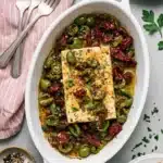 Mediterranean Baked Feta with olives, tomatoes, garlic, herbs, and olive oil.