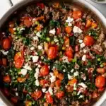 Mediterranean Ground Beef Stir Fry Recipe | Amazing 25 Minute Meal 11 Mediterranean Ground Beef Stir Fry with spinach, feta, tomatoes, and peppers in a skillet