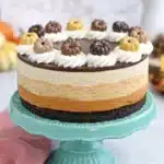 Pumpkin Chocolate Mousse Cake with creamy layers, chocolate ganache, and festive fall decorations