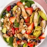 Strawberry Chicken Salad with chicken, berries, avocado, feta, pecans, and creamy balsamic dressing