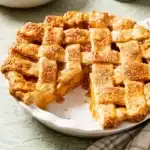 The Perfect Peach Pie Recipe | Amazing Homemade Favorite 7 The Perfect Peach Pie with flaky lattice crust and thick, juicy peach filling.