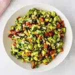 Chunky Avocado Salsa served with crispy tortilla chips and fresh cilantro