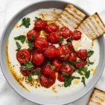 Whipped Feta Dip with Roasted Tomatoes, fresh herbs, olive oil, and crisp crackers