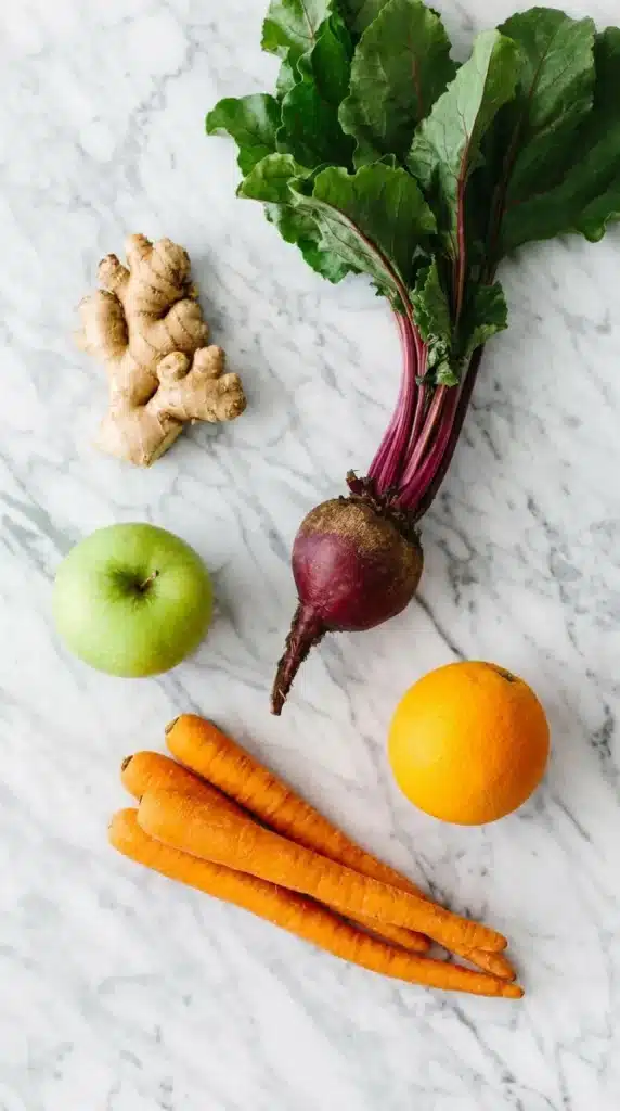 Apple Carrot Beet Smoothie : Vibrant, Easy Recipe 5 Apple Carrot Beet Smoothie ingredients with beet, carrots, apple, orange, and ginger