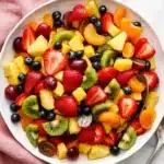 Classic Fruit Salad with strawberries, kiwi, pineapple, grapes, blueberries, mango, and mandarins