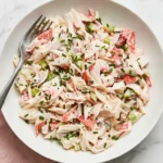 Creamy Crab Salad with celery, shallot, chives, and tender crab meat in a ceramic bowl.