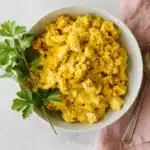 Curried Egg Salad sandwich with leafy greens on rustic sourdough bread