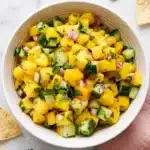 Fresh Mango Salsa with cucumber, red onion, jalapeño, cilantro, and lime