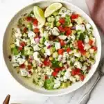 Fresh Ceviche Salad with white fish, avocado, cucumber, tomato, lime, cilantro, and red onion
