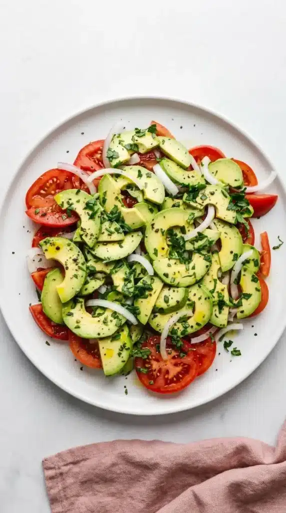 Tomato Avocado Salad layered with juicy tomatoes, creamy avocado, onion, and fresh parsley