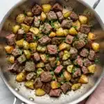 Garlic Butter Steak Bites and Potatoes Recipe : Easy Feast 11 Garlic Butter Steak Bites and Potatoes with golden potatoes and parsley in a skillet