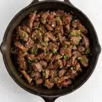 Garlic Butter Steak Bites | Amazing Easy Skillet Dinner 11 Garlic Butter Steak Bites in a cast iron skillet with parsley and garlic