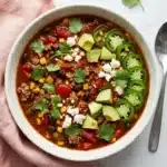 Taco Soup Recipe : Easy, Hearty 30-Minute Dinner 13 Taco Soup with ground beef, beans, corn, avocado, jalapeño, cilantro, and Cotija cheese