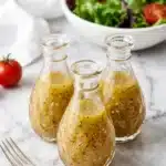 Italian Dressing recipe : Amazing Fresh Flavor in 5 Minutes 9 Homemade Italian Dressing with olive oil, garlic, herbs, and red wine vinegar in a glass jar