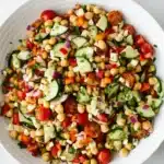 Mediterranean Chickpea Salad | Amazing Easy Lunch Recipe 11 Mediterranean Chickpea Salad with feta, cucumber, tomatoes, and parsley in a serving bowl