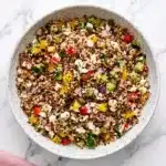 Mediterranean Quinoa Salad | Easy and Fresh Dinner Recipe 11 Mediterranean quinoa salad with feta, fresh vegetables, and lemon vinaigrette in a ceramic bowl