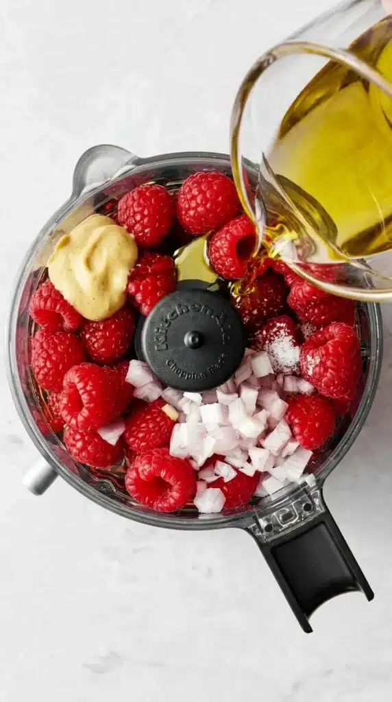 Raspberry Vinaigrette Recipe | Amazing Fresh 5 Minute Dressing 8 Raspberry Vinaigrette ingredients in a food processor before blending.