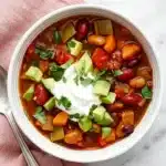 Ultimate Vegetarian Chili : Easy, Satisfying Recipe 9 Ultimate Vegetarian Chili with three beans, avocado, sour cream, cilantro, and colorful vegetables